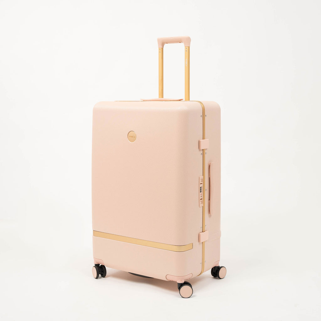 Porte-gobelet et tablette escamotables intégrés sur valise rigide Titou rose poudré