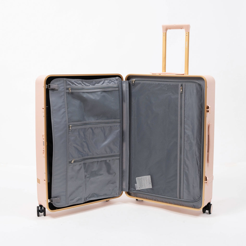 Set de 3 valises rigides rose poudré Titou avec finitions dorées et poignées télescopiques