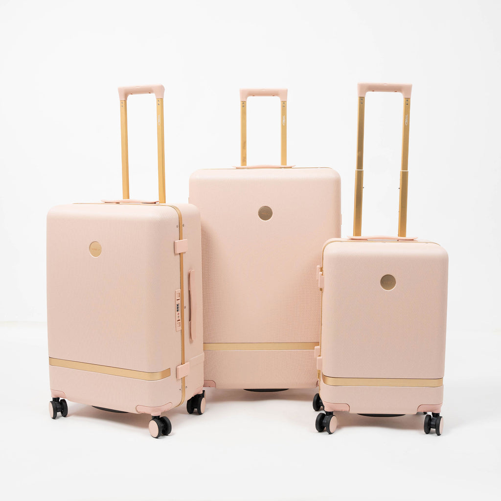 Set de 3 valises rigides rose poudré Titou avec finitions dorées et poignées télescopiques