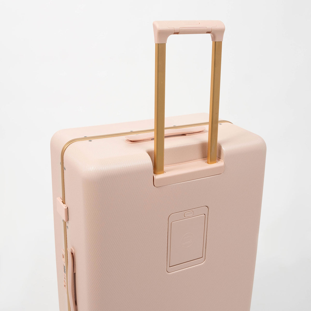 Set de 3 valises rigides rose poudré Titou avec finitions dorées et poignées télescopiques